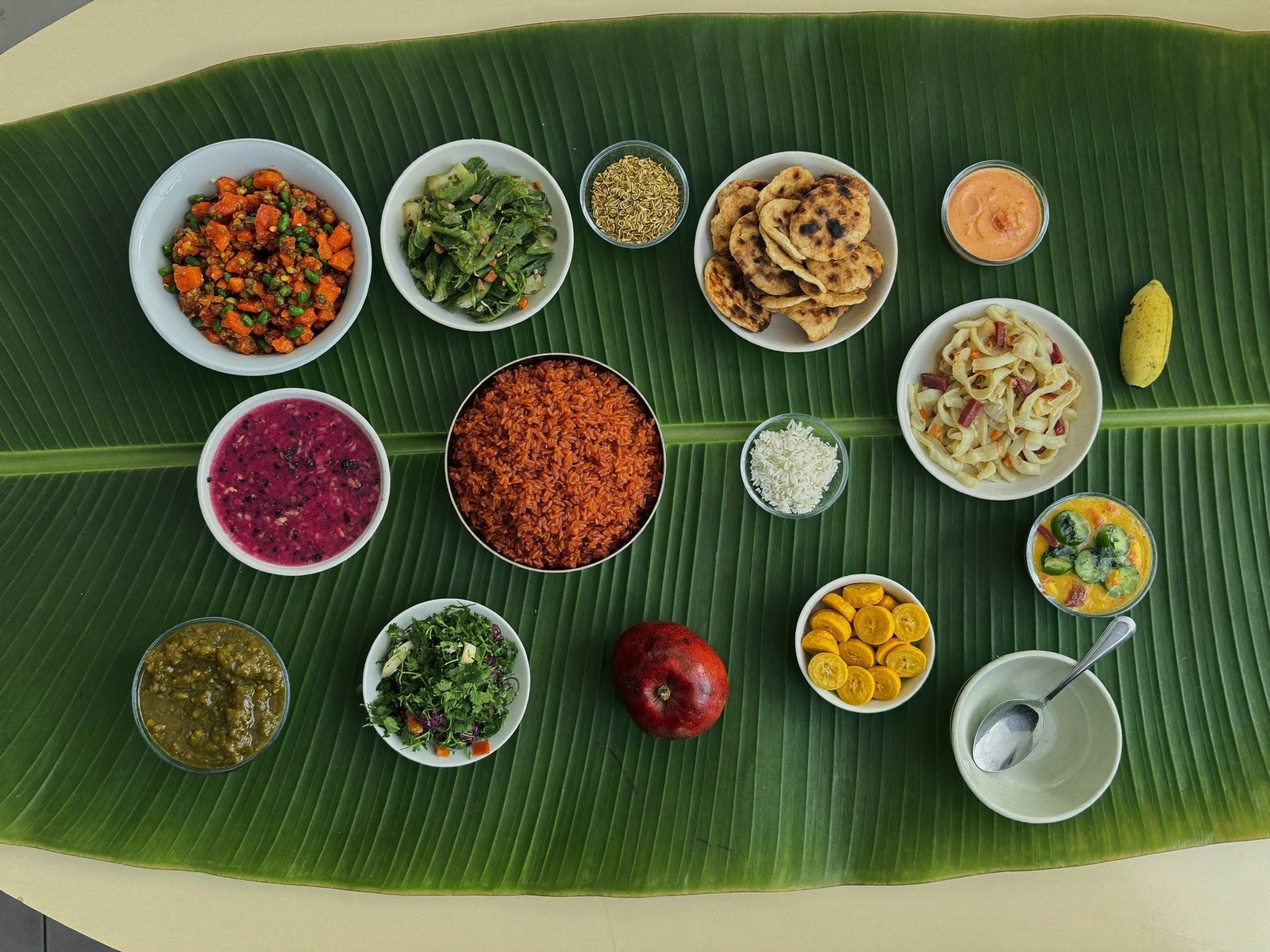 Kerala sadhya laid out on a banana leaf, seen from above